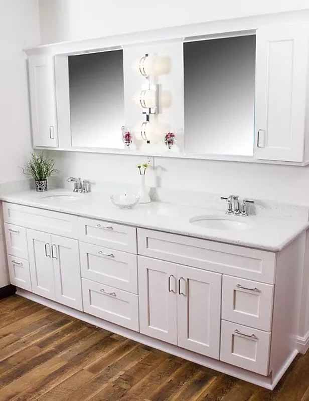 Bathroom double vanity with white cabinets and countertop