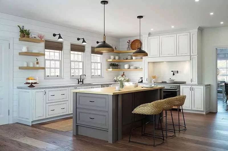 Rustic kitchen with white cabinets and grey island