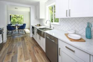 modern white kitchen with white tile backsplash