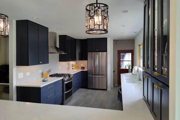 modern kitchen with dark blue cabinets